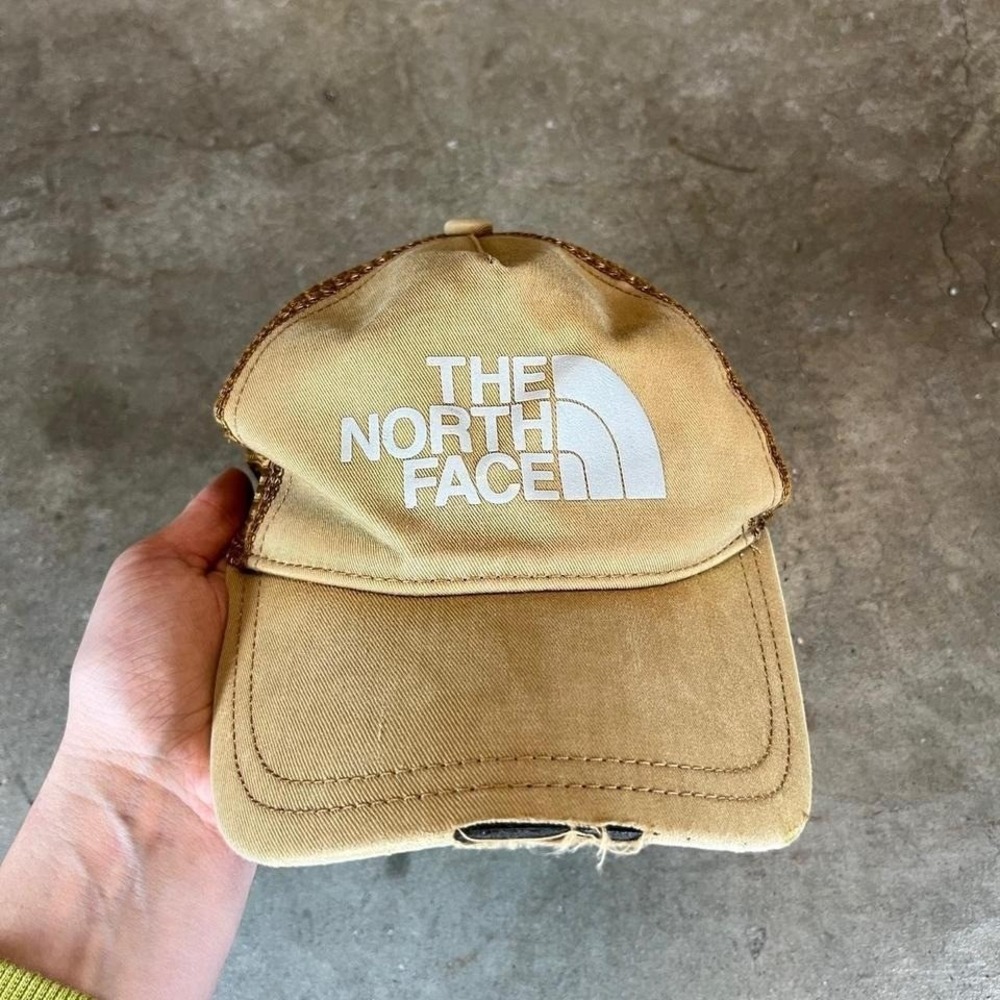 The North Face tan trucker hat